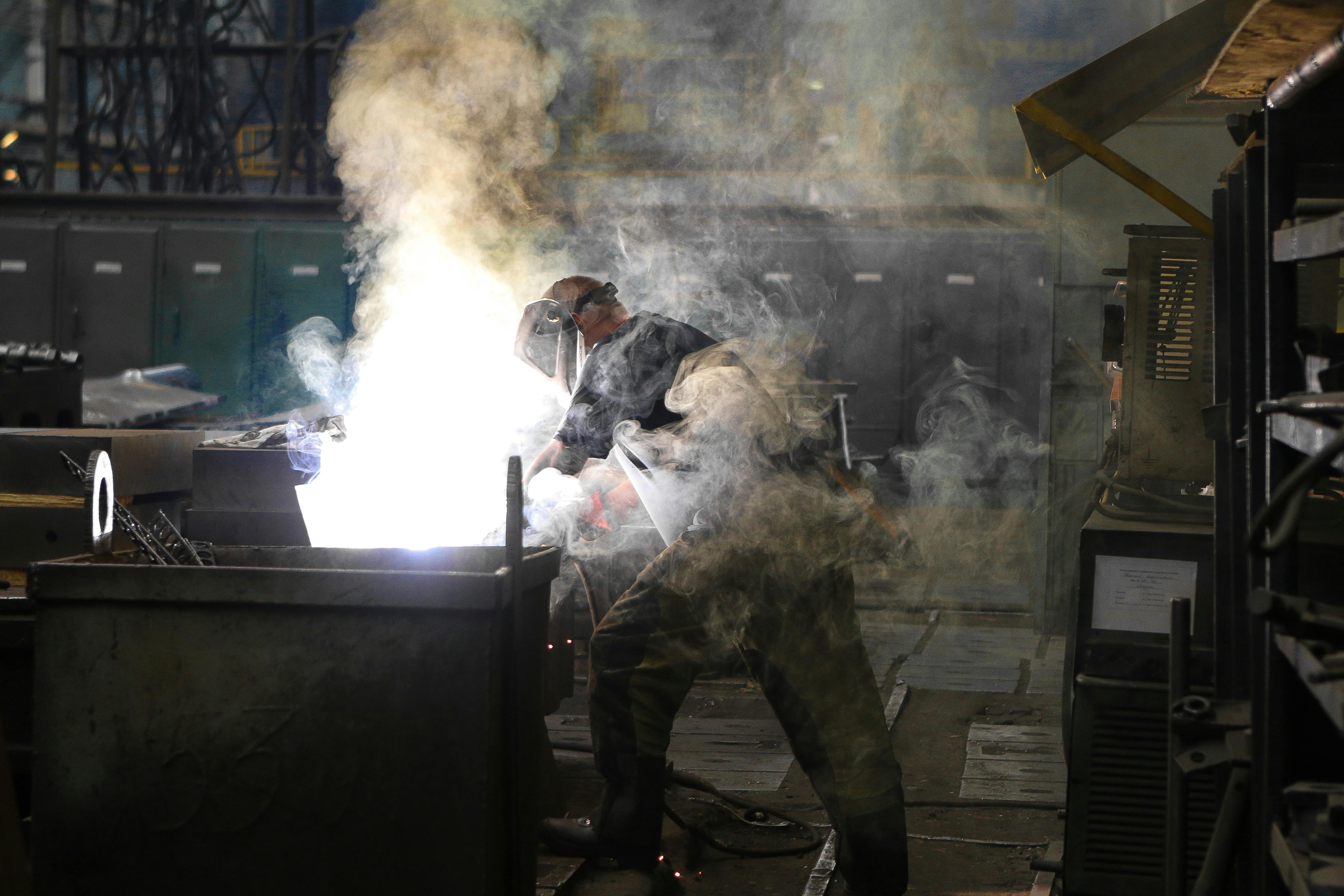 Skilled worker in modern manufacturing facility